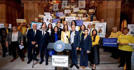 Supporters and officials celebrate the signing of New York's Medical Aid in Dying Law